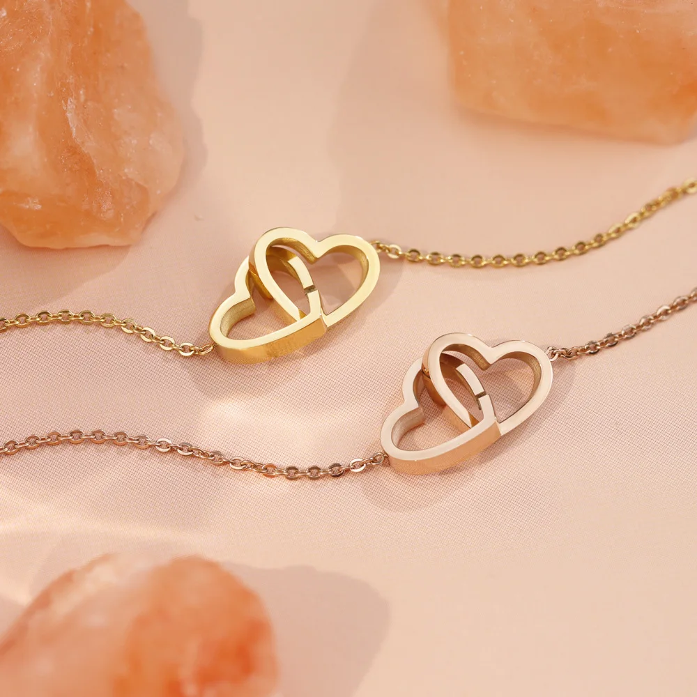 2025 Custom peach heart double ring interlocking heart shape double buckle hand ornament ins style stainless steel jewelry gift
2025 Custom peach heart double ring interlocking heart shape double buckle hand ornament ins style stainless steel jewelry gift
