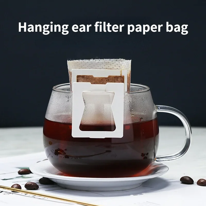 50pcs Portable Coffee Filter Paper Bags Disposable Drip Coffee Bag Handle Hanging Ear Espresso Cafe Coffee Accessories Tea Tool
50pcs Portable Coffee Filter Paper Bags Disposable Drip Coffee Bag Handle Hanging Ear Espresso Cafe Coffee Accessories Tea Tool