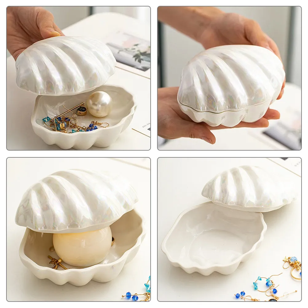 Шкатулка для украшений в форме ракушки с жемчужным блеском, контейнер для хранения мелочей, подставка для демонстрации серег, колец, ожерелий, браслетов, настольный органайзер
Шкатулка для украшений в форме ракушки с жемчужным блеском, контейнер для хранения мелочей, подставка для демонстрации серег, колец, ожерелий, браслетов, настольный органайзер