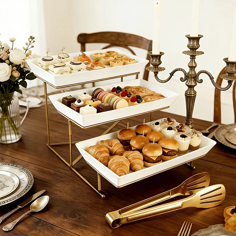 Three-tier Plastic Cake Stand with Food Tongs, Made of High-quality Plastic, Featuring a Sturdy Crossbar Support for Stability. It Is Lightweight, Durable, and Foldable, Making It Ideal for Parties, Weddings, and Family Gatherings
Three-tier Plastic Cake Stand with Food Tongs, Made of High-quality Plastic, Featuring a Sturdy Crossbar Support for Stability. It Is Lightweight, Durable, and Foldable, Making It Ideal for Parties, Weddings, and Family Gatherings