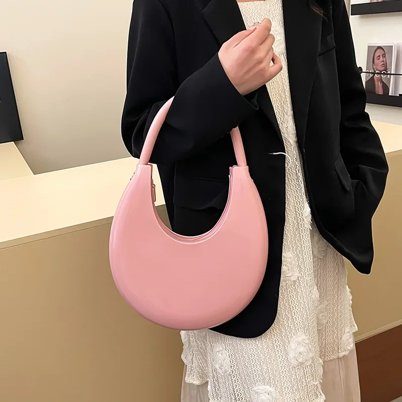 Women's Candy Colored Moon Shaped PVC Jelly Bag with One Shoulder Handle Fashionable Transparent Handbag
Women's Candy Colored Moon Shaped PVC Jelly Bag with One Shoulder Handle Fashionable Transparent Handbag