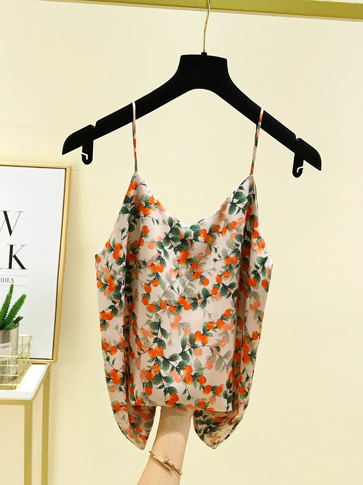 New orange colored satin camisole vest with V-neck and sleeveless design, paired with a suit and worn as a base
New orange colored satin camisole vest with V-neck and sleeveless design, paired with a suit and worn as a base