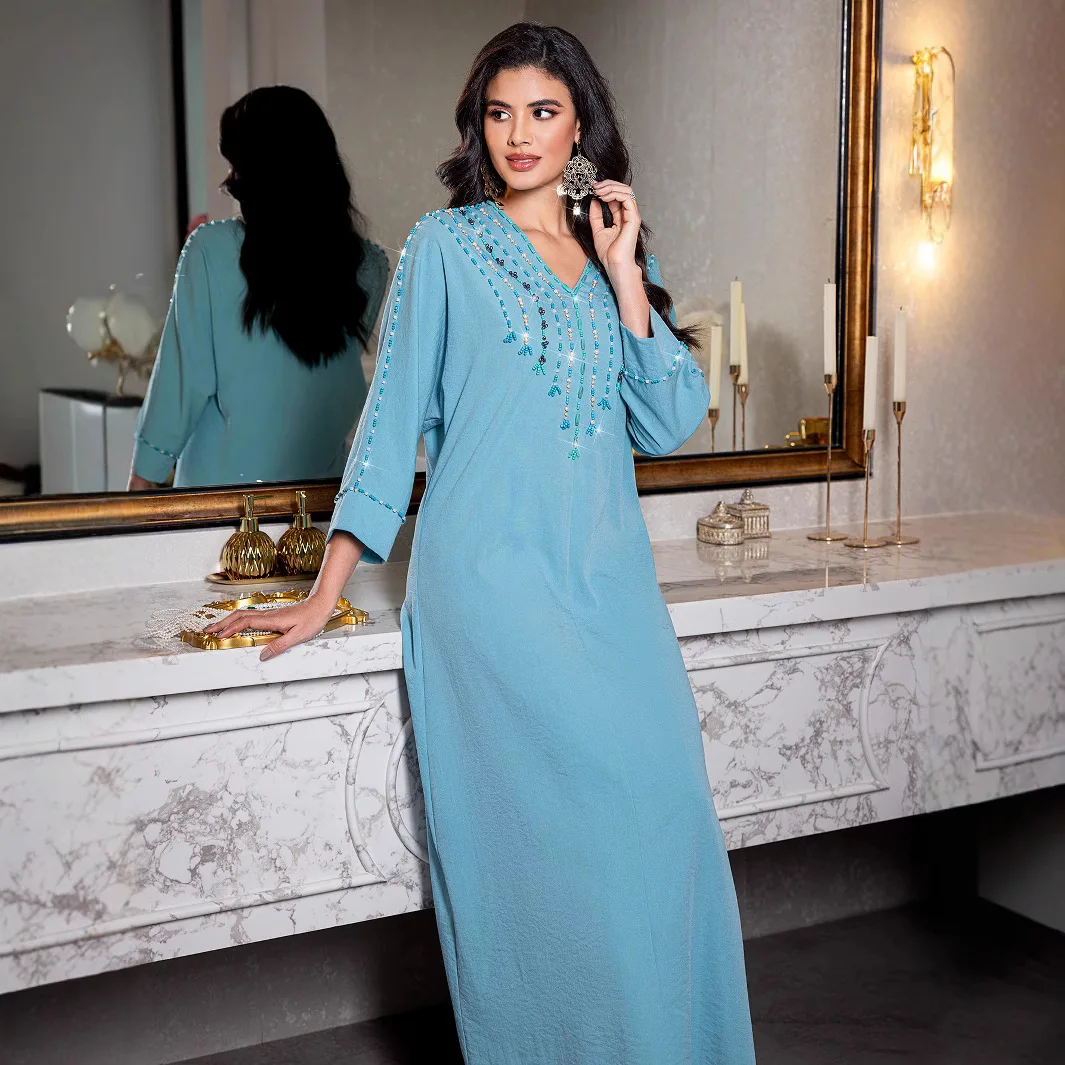 Turkish Women's Clothing. A Fashionable V-neck Long Dress for Women, with Hand-sewn Diamonds, Presenting A Light Luxury Style.
Turkish Women's Clothing. A Fashionable V-neck Long Dress for Women, with Hand-sewn Diamonds, Presenting A Light Luxury Style.