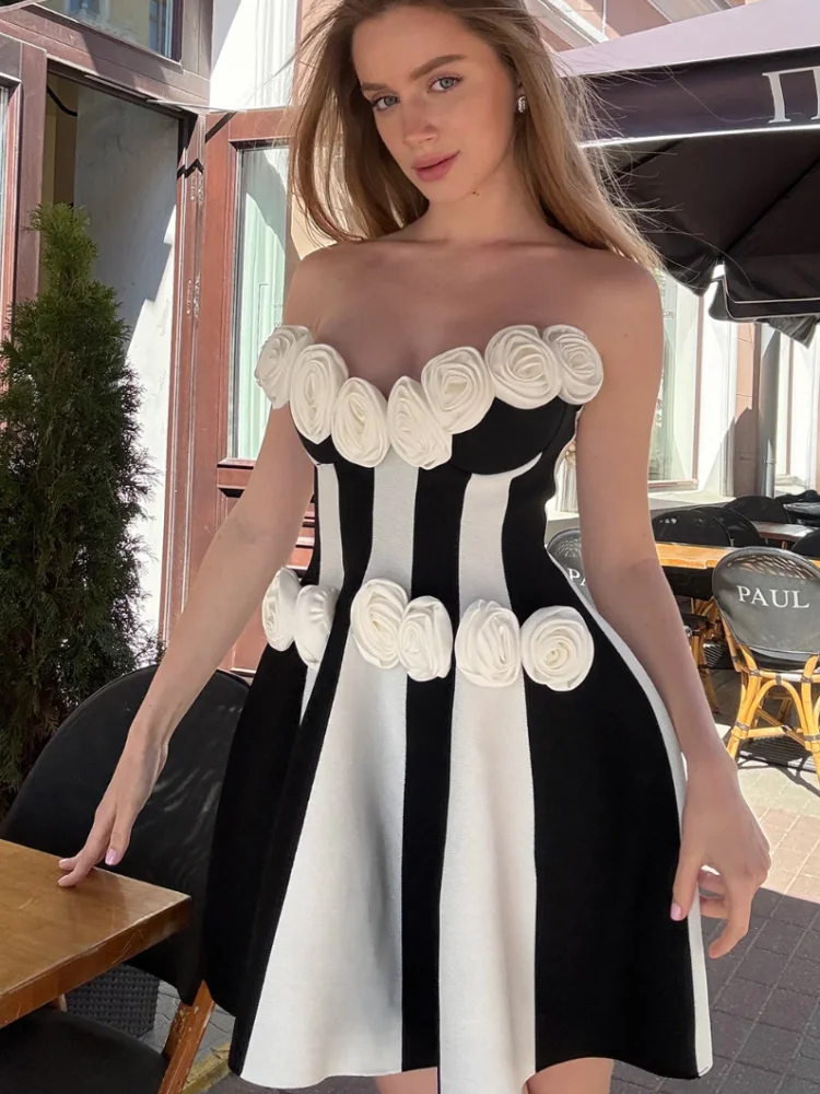 VC Glamorous Black and White Strapless Mini Dress with 3D Rose Embellishments for Party Nights
VC Glamorous Black and White Strapless Mini Dress with 3D Rose Embellishments for Party Nights