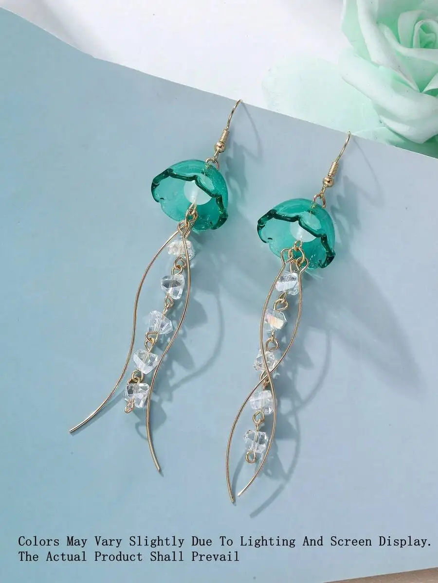 Handcrafted Jellyfish Drop Earrings With Twisted Wire And Crystal Bead Tassels, Seafoam Green Pendant For Summer Beach And
Handcrafted Jellyfish Drop Earrings With Twisted Wire And Crystal Bead Tassels, Seafoam Green Pendant For Summer Beach And