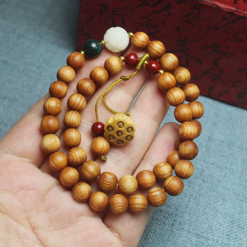 Banyan wood high-oil 8mm double-layer bracelet with lotus pod pendant, unisex cultural and artistic prayer bead jewelry
Banyan wood high-oil 8mm double-layer bracelet with lotus pod pendant, unisex cultural and artistic prayer bead jewelry