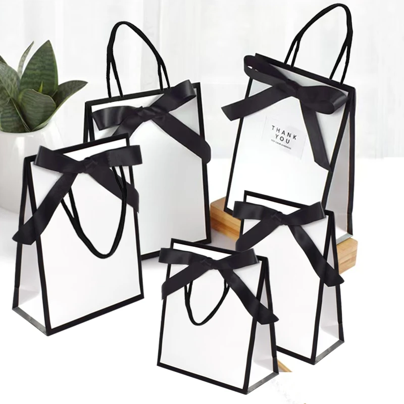 10pcs Ribbon Bow White Pardboard Paper Tote Gift Bags with Handles Shopping Party Wedding Party Birthday Retail Packaging Bags
10pcs Ribbon Bow White Pardboard Paper Tote Gift Bags with Handles Shopping Party Wedding Party Birthday Retail Packaging Bags