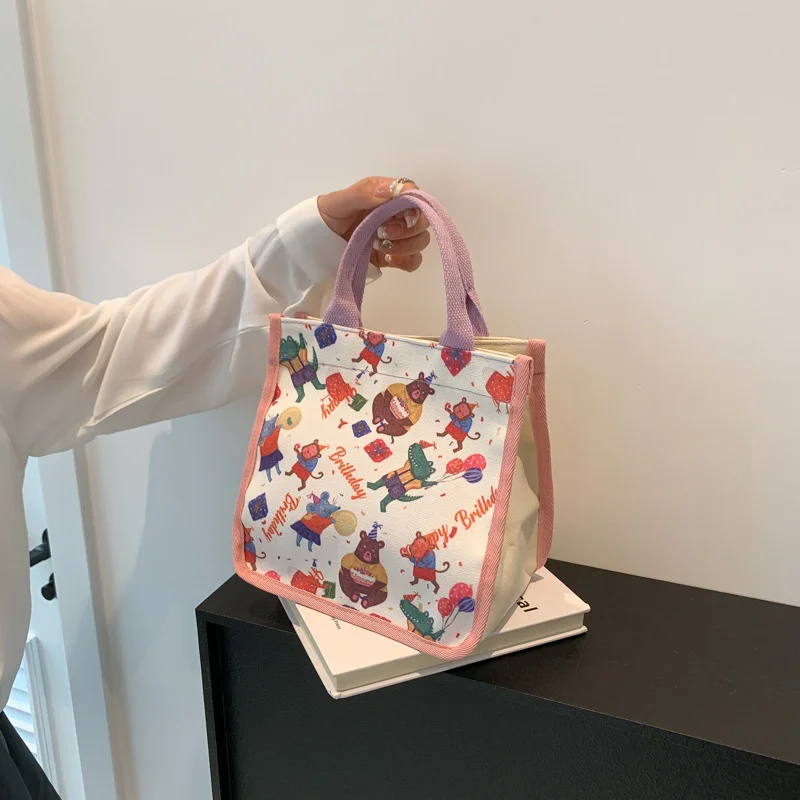 2025 Cute Cartoon Printing Large Capacity Handbag Portable Lunch Bento Tote Bag Items Storage Bag
2025 Cute Cartoon Printing Large Capacity Handbag Portable Lunch Bento Tote Bag Items Storage Bag