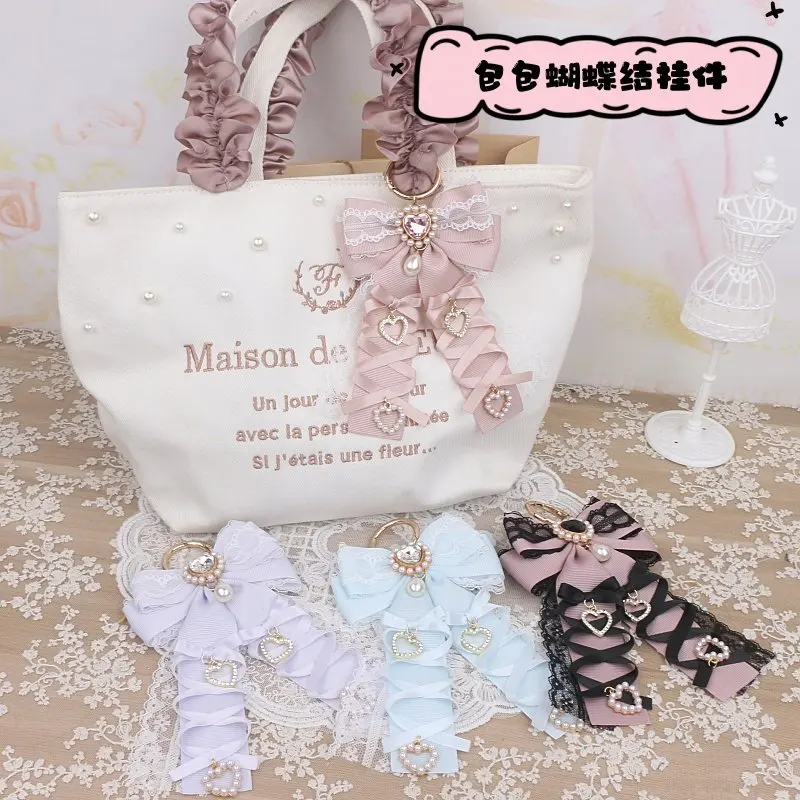 Брелок ручной работы с бусинами и цепочкой, милый кулон в стиле Лолита с бантом из ленты, подвеска со стразами для сумки, украшение для сумки Ita Bag
Брелок ручной работы с бусинами и цепочкой, милый кулон в стиле Лолита с бантом из ленты, подвеска со стразами для сумки, украшение для сумки Ita Bag