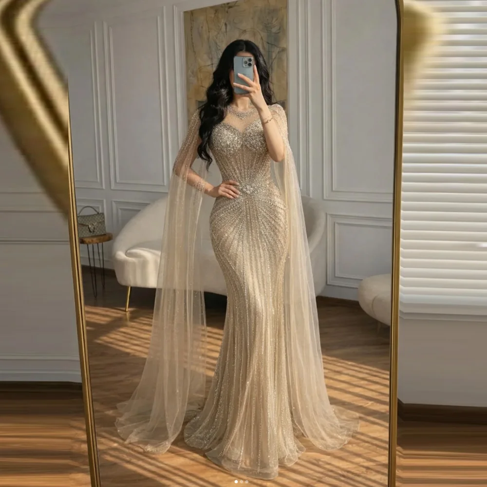 Customized Nude Luxury Beaded Mermaid Cape Sleeves Evening Dress 2026 Women Occasion Party Gown
Customized Nude Luxury Beaded Mermaid Cape Sleeves Evening Dress 2026 Women Occasion Party Gown
