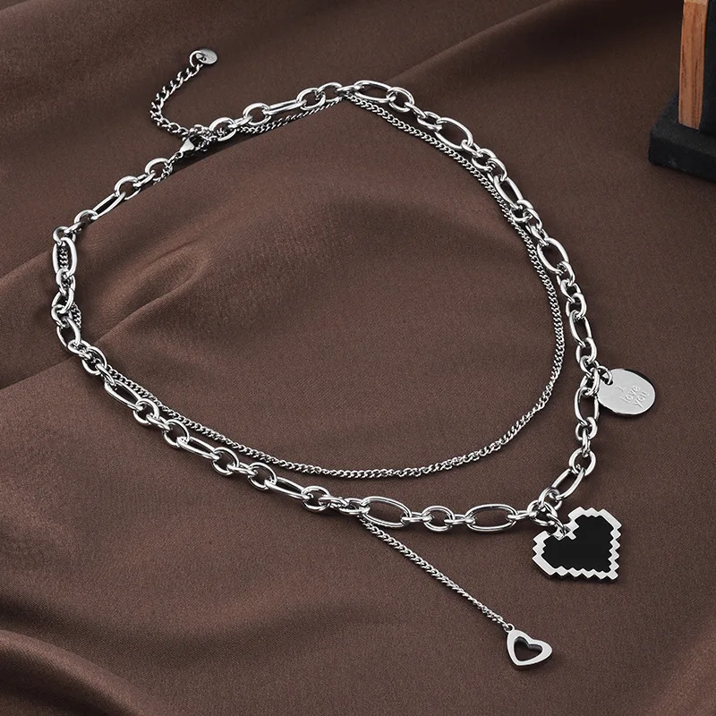 A new titanium steel double-layer Mosaic heart-shaped necklace with a simple letter pendant
A new titanium steel double-layer Mosaic heart-shaped necklace with a simple letter pendant