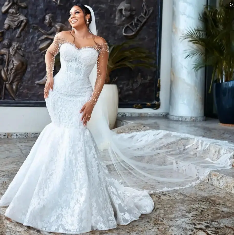 Arabic Dubai Mermaid Wedding Dresses 2026 Sheer Neck Long Sleeves Pears Beads Lace Bridal Formal Gown Bride Dress Vestidos
Arabic Dubai Mermaid Wedding Dresses 2026 Sheer Neck Long Sleeves Pears Beads Lace Bridal Formal Gown Bride Dress Vestidos