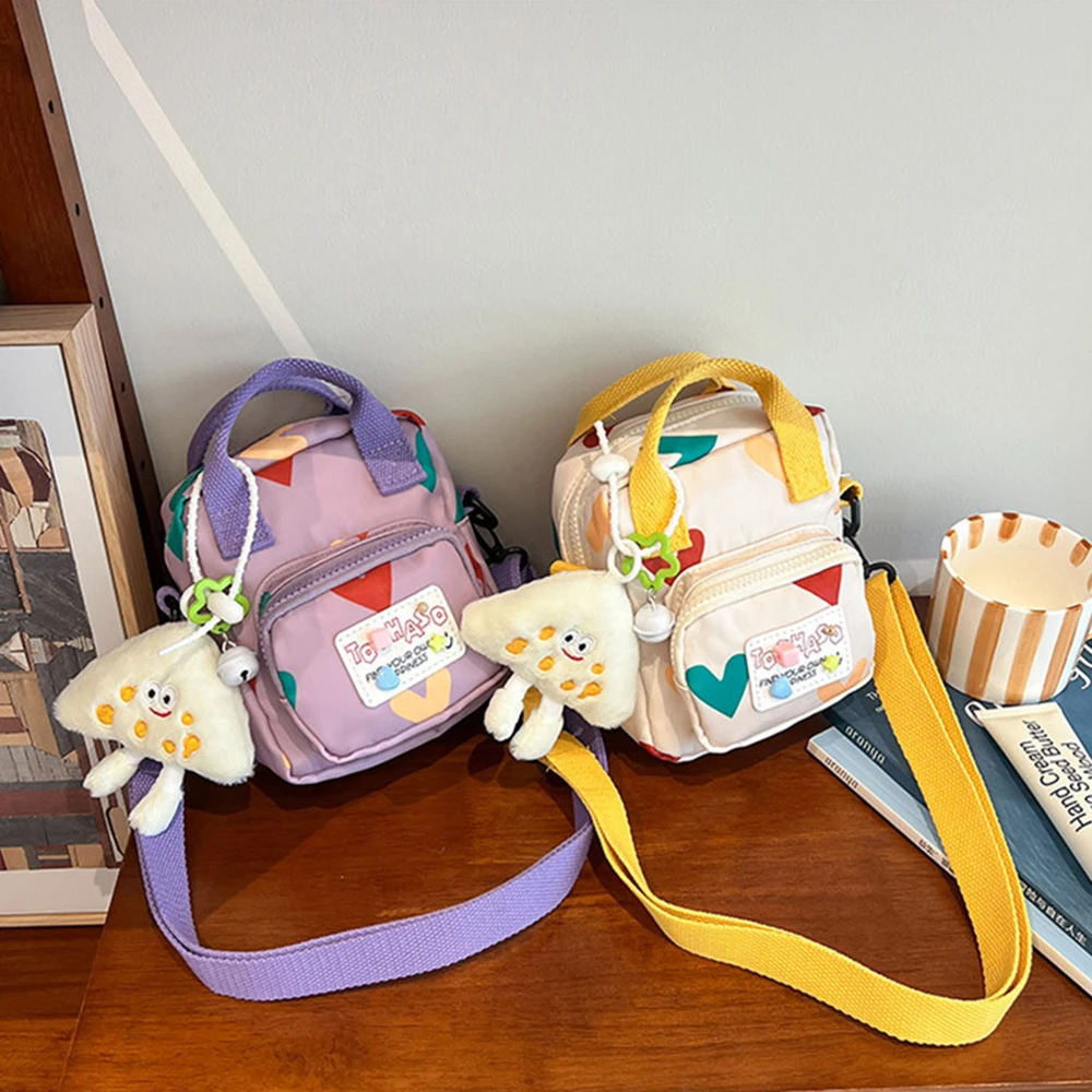 Korean Style Crossbody Shoulder Bag Cartoon Love Heart Printed Mini Dopamine Handbag with Pendant Fashion Children Messenger Bag
Korean Style Crossbody Shoulder Bag Cartoon Love Heart Printed Mini Dopamine Handbag with Pendant Fashion Children Messenger Bag