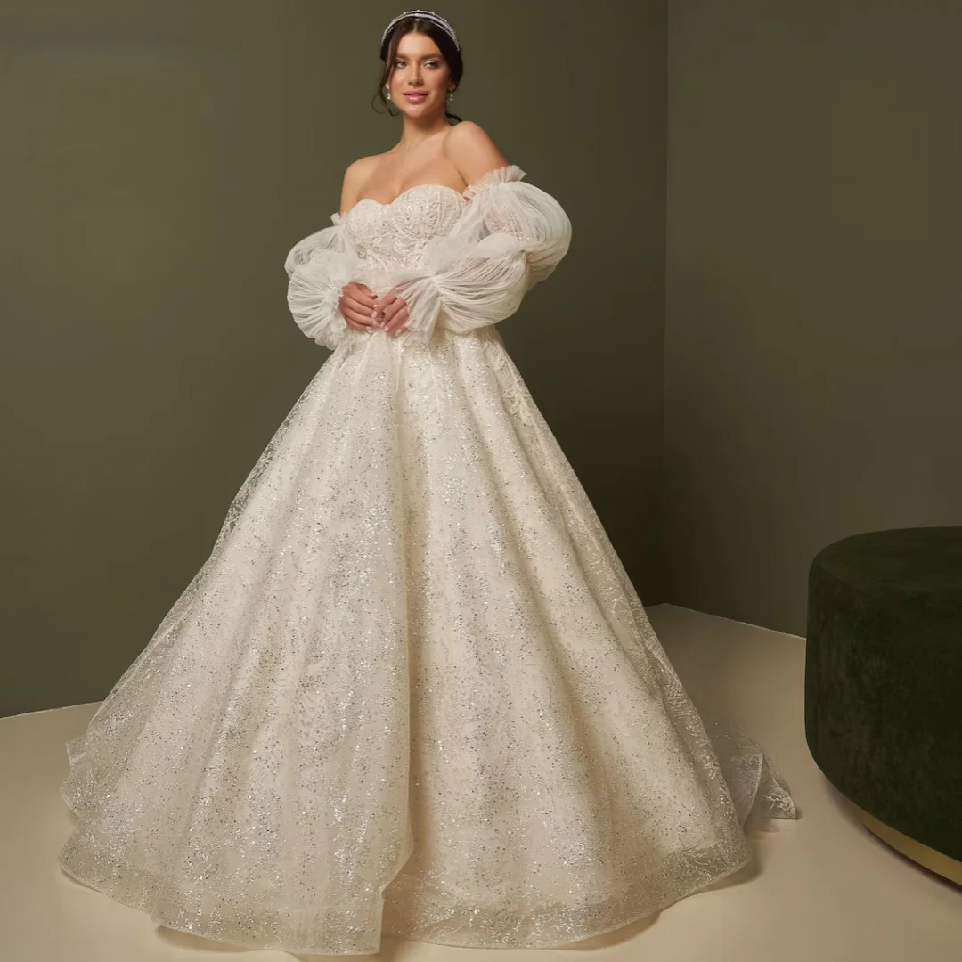 Customized Luxury Off Shoulder A-line Wedding Dress Fluffy Sleeves Shining Bridal Ball Dress Lace Decorated Bridal Dress
Customized Luxury Off Shoulder A-line Wedding Dress Fluffy Sleeves Shining Bridal Ball Dress Lace Decorated Bridal Dress
