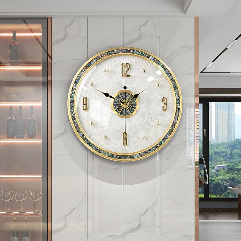 Modern light luxury shell wall clock brass European wall watch simple living room Nordic
Modern light luxury shell wall clock brass European wall watch simple living room Nordic