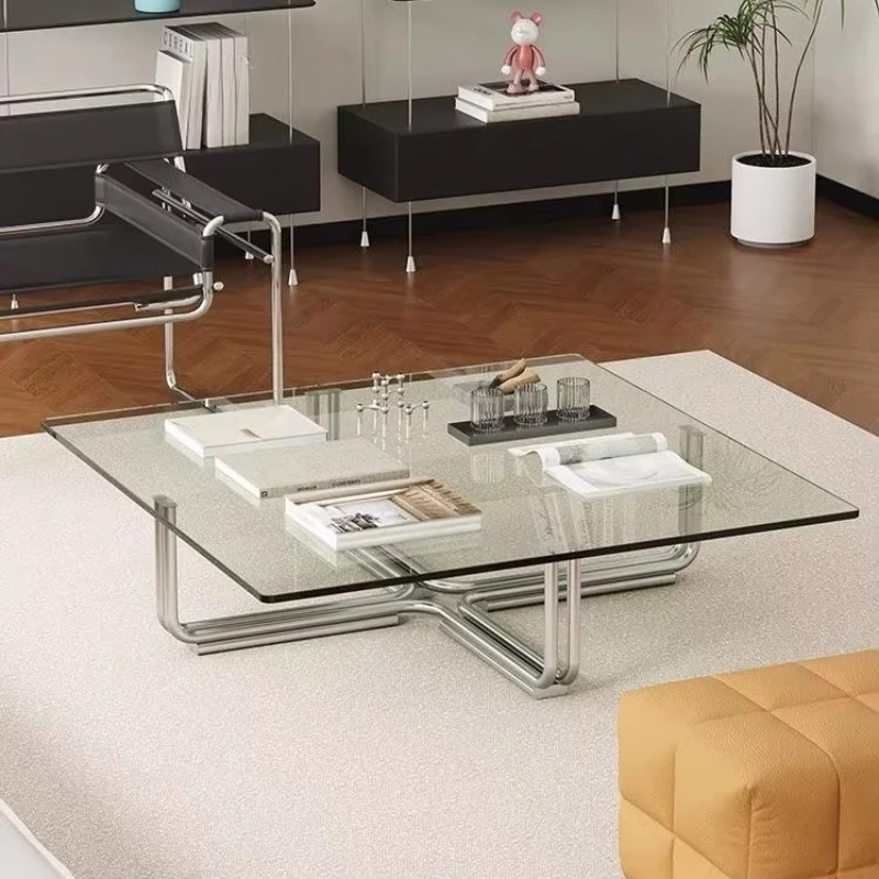 A home office with a modern square coffee table and transparent living room furniture with tempered glass and metal frames
A home office with a modern square coffee table and transparent living room furniture with tempered glass and metal frames