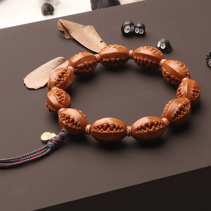 Hand Carved Olive Pit Iron Core Three-sided Carved Bracelet with Tassel, Unisex Gift & Plaything
Hand Carved Olive Pit Iron Core Three-sided Carved Bracelet with Tassel, Unisex Gift & Plaything