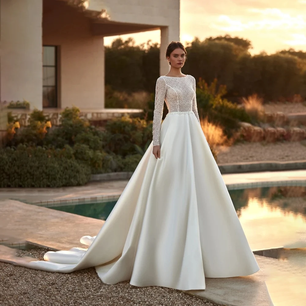 Luxury A Line Bridal Gowns 2024 O-neck Long Sleeve Backless Satin Wedding Dress Custom Made High Quality Princess Bride Dresses
Luxury A Line Bridal Gowns 2024 O-neck Long Sleeve Backless Satin Wedding Dress Custom Made High Quality Princess Bride Dresses