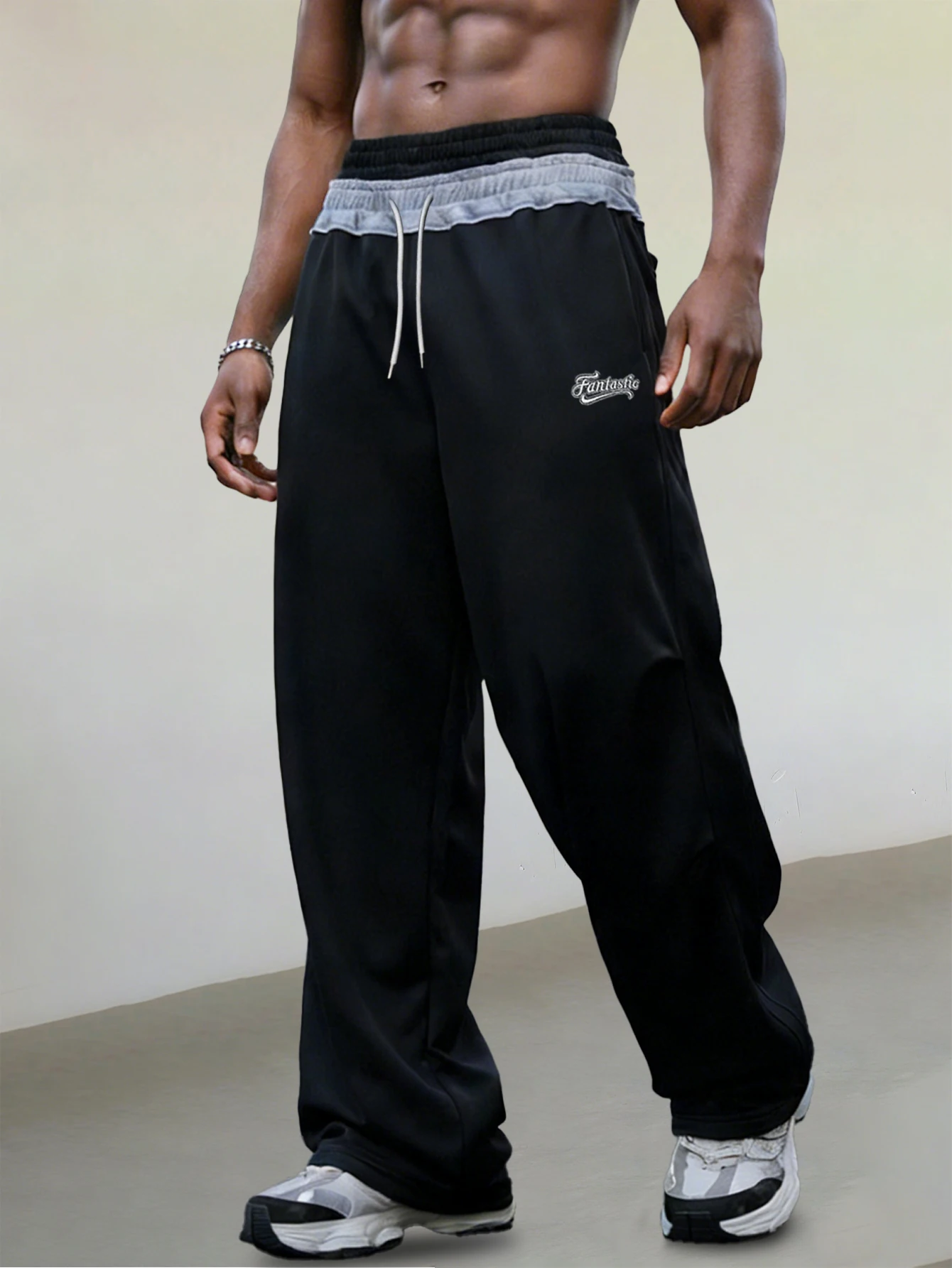 Мужские уличные спортивные брюки с многослойным поясом – черные свободные брюки в стиле хип-хоп с вышивкой "Фантастик" и контрастным шнурком | Лоос
Мужские уличные спортивные брюки с многослойным поясом – черные свободные брюки в стиле хип-хоп с вышивкой "Фантастик" и контрастным шнурком | Лоос
