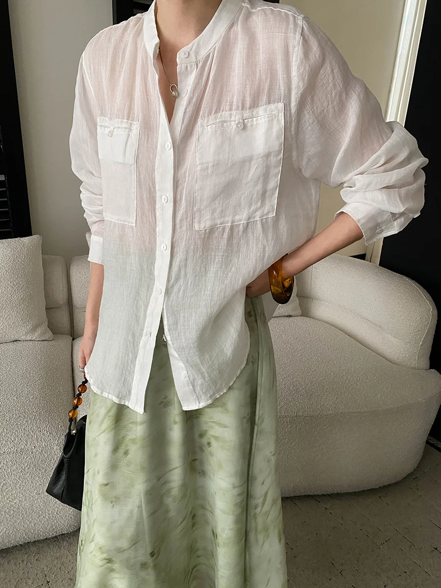 Summer women's casual solid color stand up collar loose and slightly transparent sunscreen long sleeved shirt
Summer women's casual solid color stand up collar loose and slightly transparent sunscreen long sleeved shirt