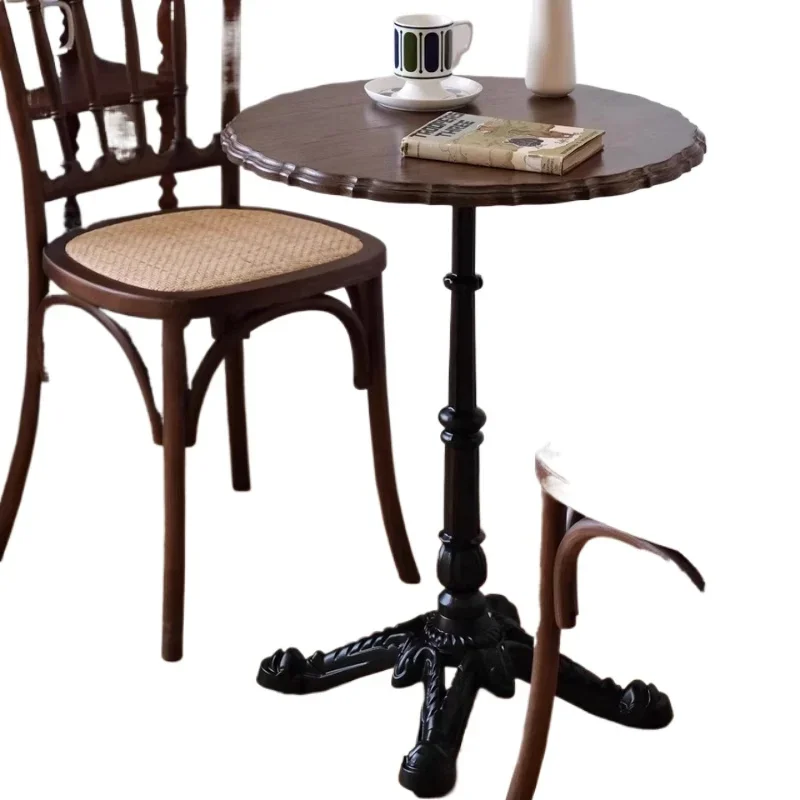 French retro solid wood round table, antique wrought iron small side table in coffee shop dessert shop
French retro solid wood round table, antique wrought iron small side table in coffee shop dessert shop