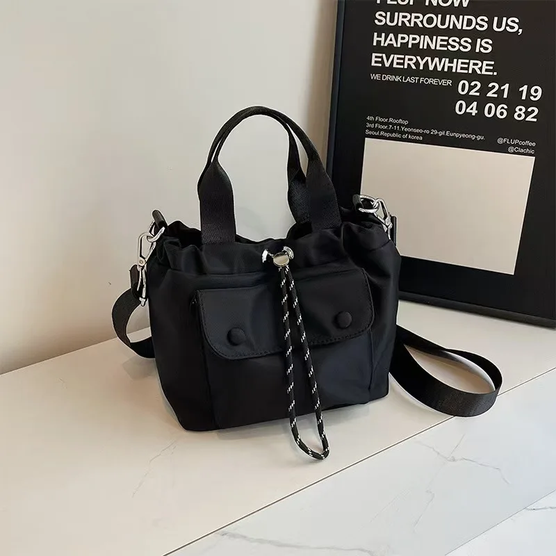 Leisure drawstring bucket bag, versatile and lightweight Oxford cloth tote bag, single shoulder crossbody bag, small tote bag
Leisure drawstring bucket bag, versatile and lightweight Oxford cloth tote bag, single shoulder crossbody bag, small tote bag