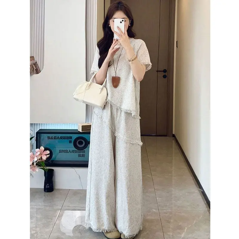 Round Neck Top and Wide Leg Pants Two-piece Set for Women 2026 Summer New Style Slimming and Fashionable Set
Round Neck Top and Wide Leg Pants Two-piece Set for Women 2026 Summer New Style Slimming and Fashionable Set