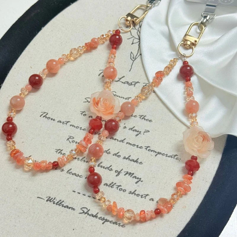 Natural sunstone, red agate, sunstone gravel, carved resin camellia, handmade beaded phone unique fashionable design keychain
Natural sunstone, red agate, sunstone gravel, carved resin camellia, handmade beaded phone unique fashionable design keychain