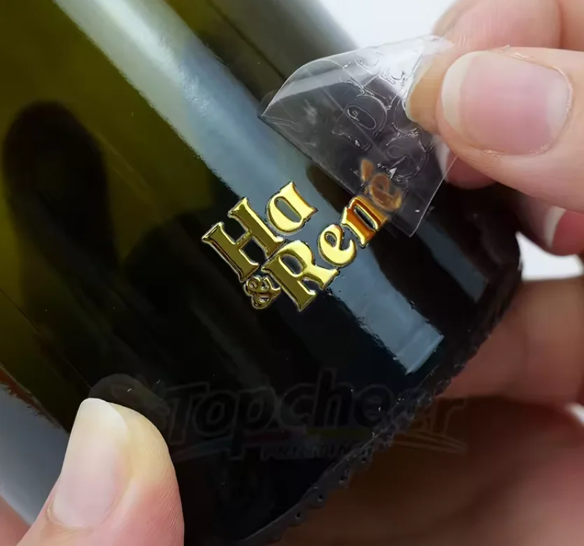 Индивидуальные прозрачные УФ-переводные наклейки с прочными логотипами горячего тиснения и металлическими этикетками торговой марки.
Индивидуальные прозрачные УФ-переводные наклейки с прочными логотипами горячего тиснения и металлическими этикетками торговой марки.