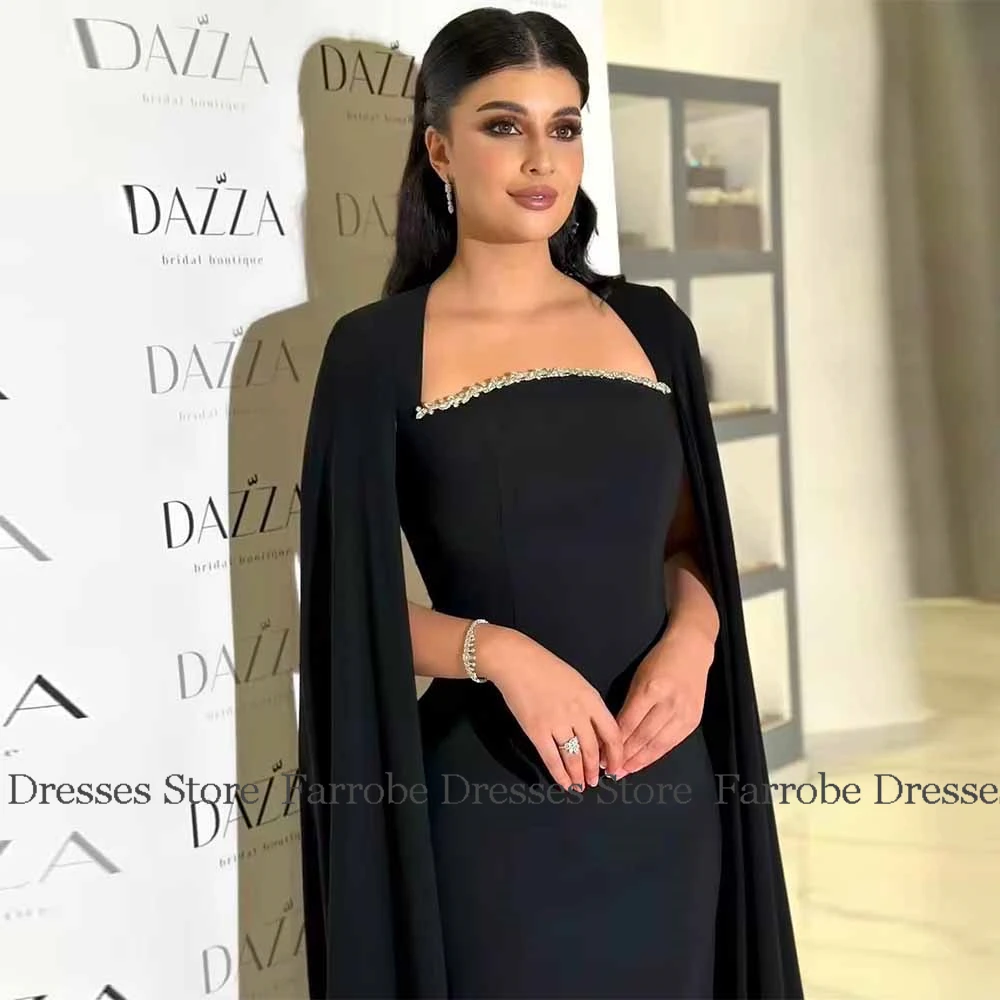 Saudi Arabia 2025 Evening Dress for Women Crepe Fabric Sheath Prom Dress Black Square Neck Crystals Cloak Sleeves Party Dress
Saudi Arabia 2025 Evening Dress for Women Crepe Fabric Sheath Prom Dress Black Square Neck Crystals Cloak Sleeves Party Dress