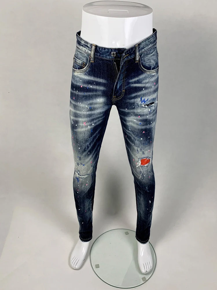 Fashionable new painted blue jeans with pleats, washed water, nostalgic stretch, slim fit, retro jeans, designer high street hip
Fashionable new painted blue jeans with pleats, washed water, nostalgic stretch, slim fit, retro jeans, designer high street hip