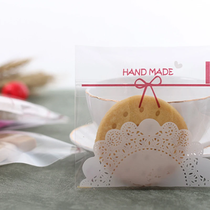 100Pcs Transparent Bow Cookie Plastic Packaging Bags Cake Candy Opp Self Adhesive Wrapping Bag Birthday Gift Wedding Party Decor
100Pcs Transparent Bow Cookie Plastic Packaging Bags Cake Candy Opp Self Adhesive Wrapping Bag Birthday Gift Wedding Party Decor