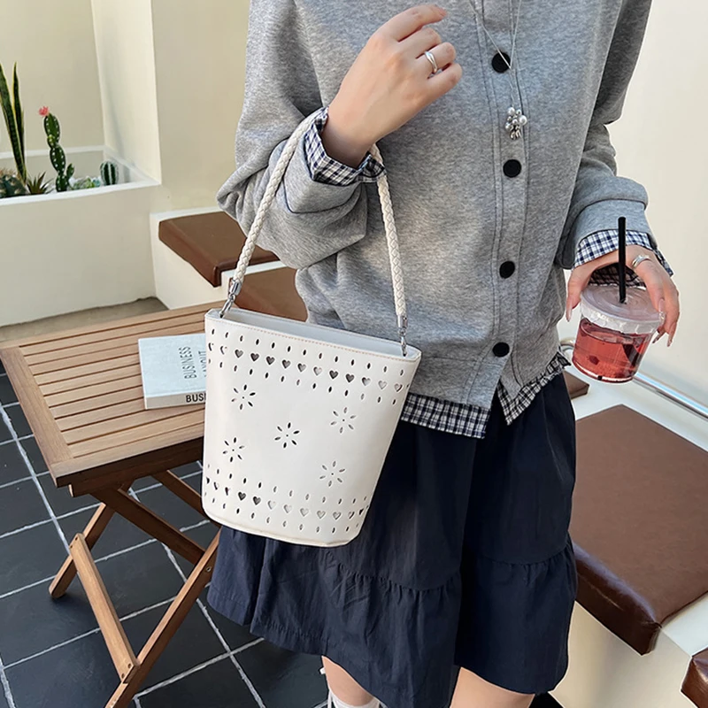 PU Hollow Out Bucket Bag For Women Solid Color Luxury Design Shoulder Bags Korean Casual Fashion Chic Female Handbags
PU Hollow Out Bucket Bag For Women Solid Color Luxury Design Shoulder Bags Korean Casual Fashion Chic Female Handbags