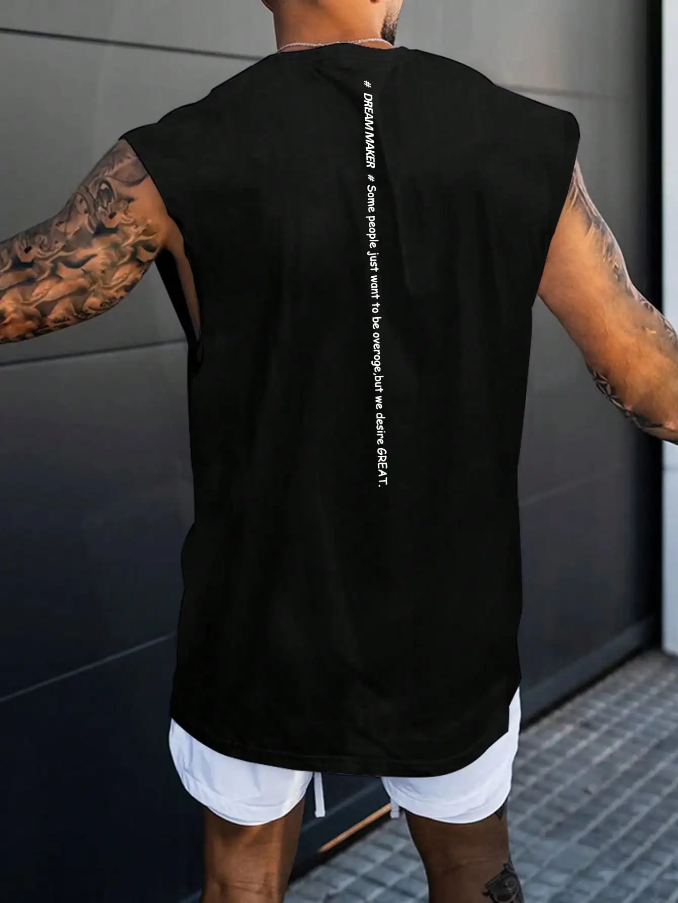 Men's Black Sleeveless Tank Top with Vertical Slogan Print, Loose Fit for Gym and Casual Wear
Men's Black Sleeveless Tank Top with Vertical Slogan Print, Loose Fit for Gym and Casual Wear