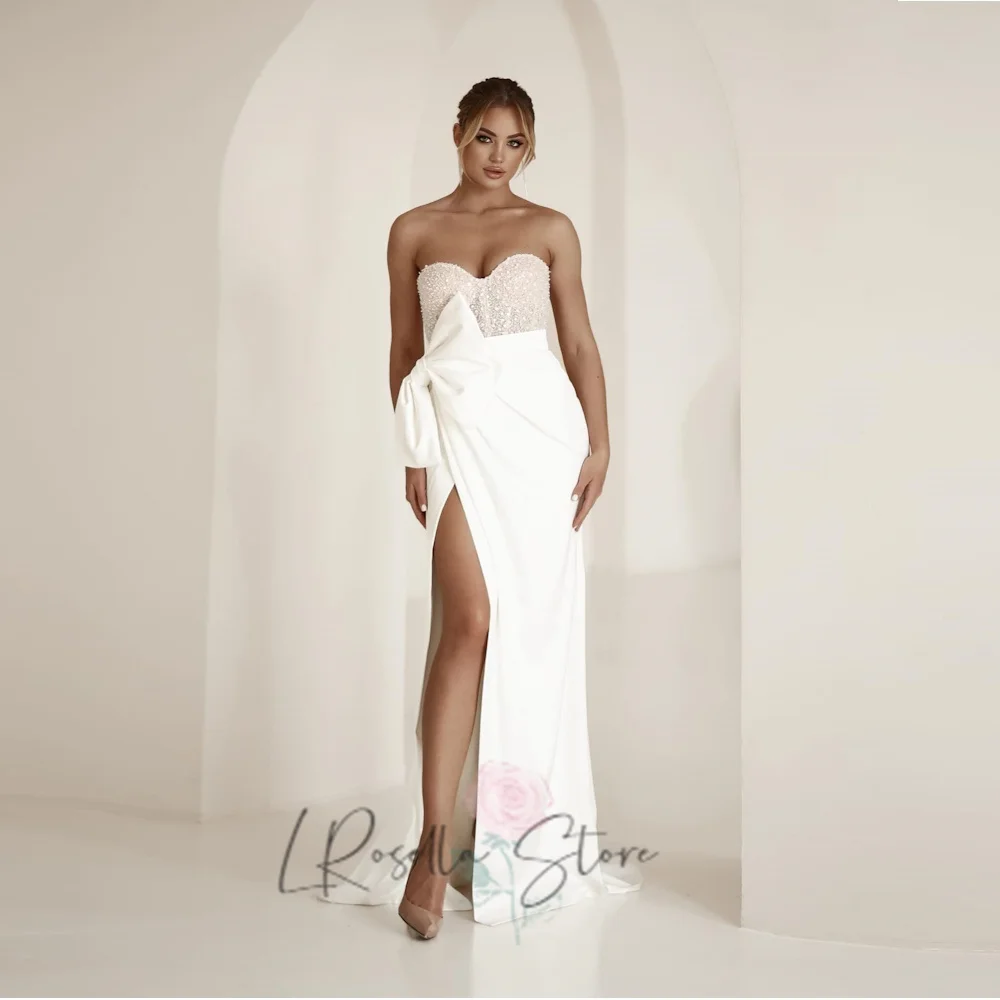 LRosella Sexy Sweetheart Neckline Sleeveless Shiny Beaded Sequined Tulle with Bow Bridal Gown Customized Mermaid Wedding Dresses
LRosella Sexy Sweetheart Neckline Sleeveless Shiny Beaded Sequined Tulle with Bow Bridal Gown Customized Mermaid Wedding Dresses