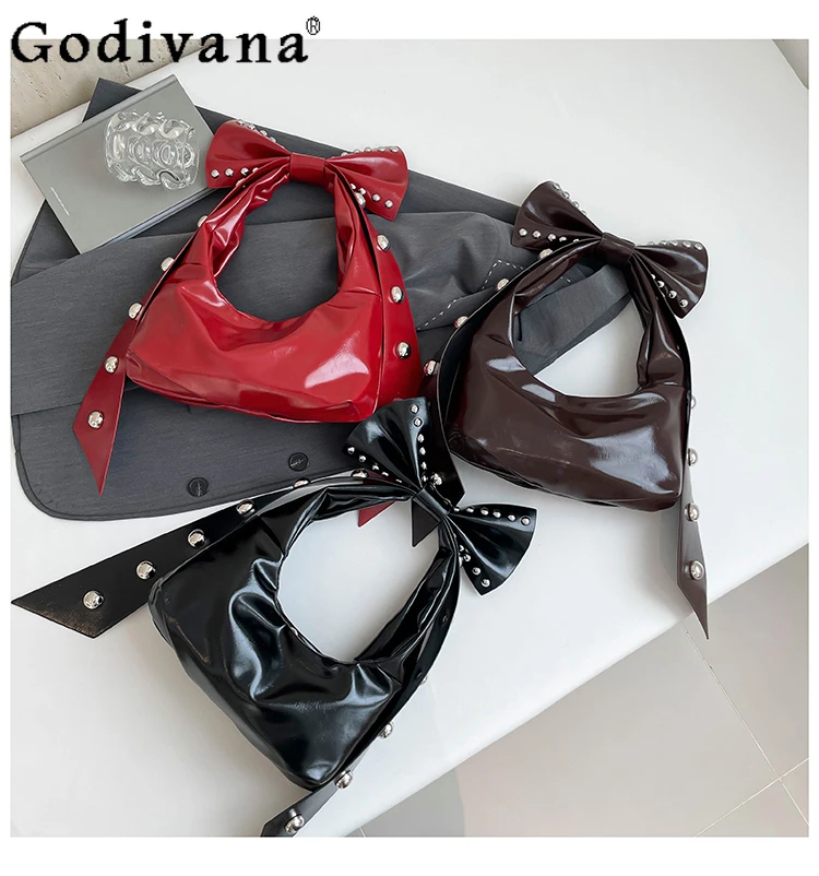 2025 New Personalized Bow Design Feeling Rivet Shoulder Armpit Bag Sweet Cool Girl Fashion Trend Daily Shopping Handbag
2025 New Personalized Bow Design Feeling Rivet Shoulder Armpit Bag Sweet Cool Girl Fashion Trend Daily Shopping Handbag