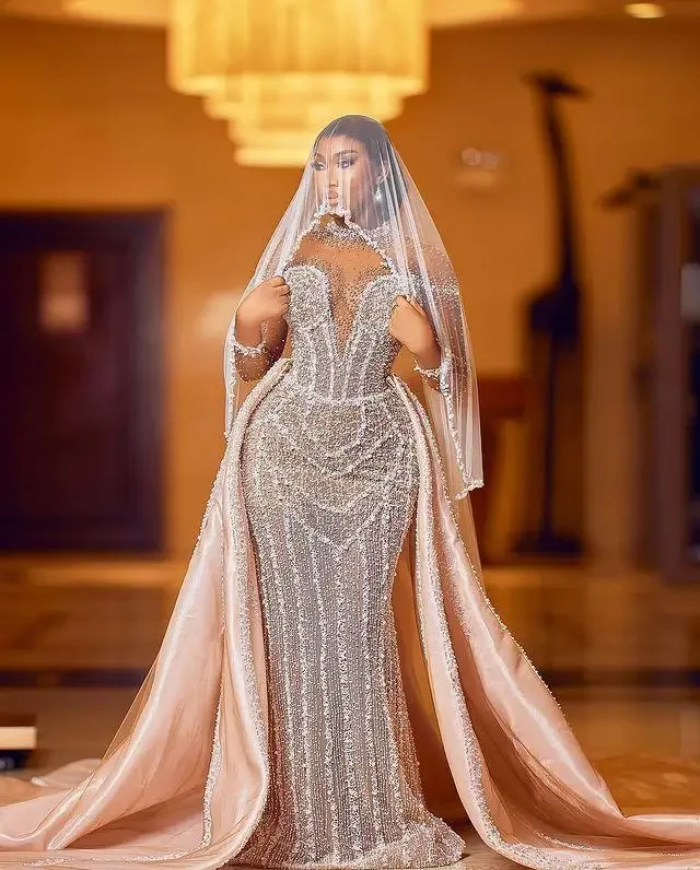 Customized Arabic Plus Size Champagne Mermaid Wedding Dress For Bride Pearls Beaded Sequined Lace Bridal Gowns Dresses
Customized Arabic Plus Size Champagne Mermaid Wedding Dress For Bride Pearls Beaded Sequined Lace Bridal Gowns Dresses