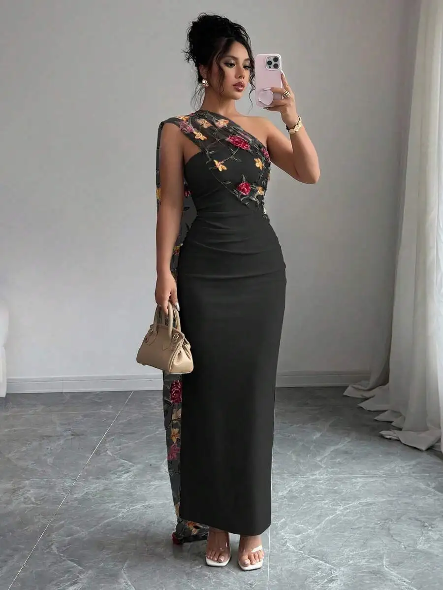 Black Floor-Length One-Shoulder Gown With Floral-Embroidered Sheer Mesh Asymmetrical Drape And Ruched Waist
Black Floor-Length One-Shoulder Gown With Floral-Embroidered Sheer Mesh Asymmetrical Drape And Ruched Waist