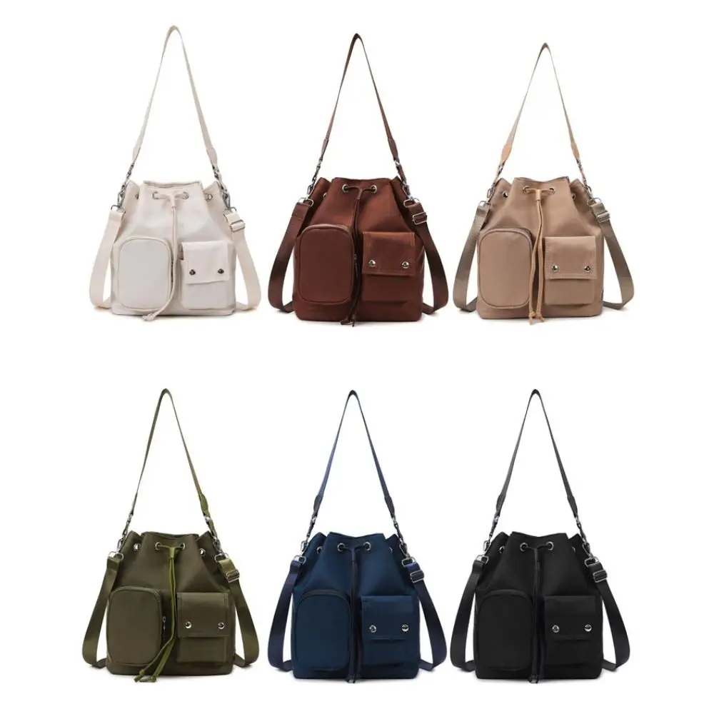 Korean Style Drawstring Bucket Bag Solid Color Large Capacity Nylon Crossbody Bag Niche Design Underarm Bag Canvas Shoulder Bag
Korean Style Drawstring Bucket Bag Solid Color Large Capacity Nylon Crossbody Bag Niche Design Underarm Bag Canvas Shoulder Bag