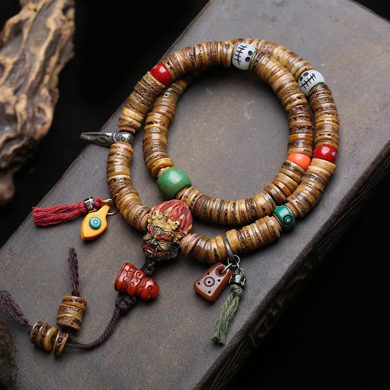 Tibetan-style 108-bead prayer beads made from camel bone, featuring a Black Dharma King design with yak bone and cloud-patterned
Tibetan-style 108-bead prayer beads made from camel bone, featuring a Black Dharma King design with yak bone and cloud-patterned