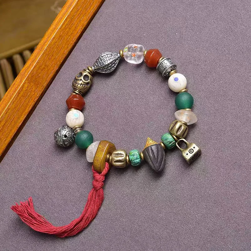 Tibetan cultural artifact multi-bead bracelet with single loop, featuring Nangla Tsatsa, turquoise, agate, recycled bone, and 99
Tibetan cultural artifact multi-bead bracelet with single loop, featuring Nangla Tsatsa, turquoise, agate, recycled bone, and 99