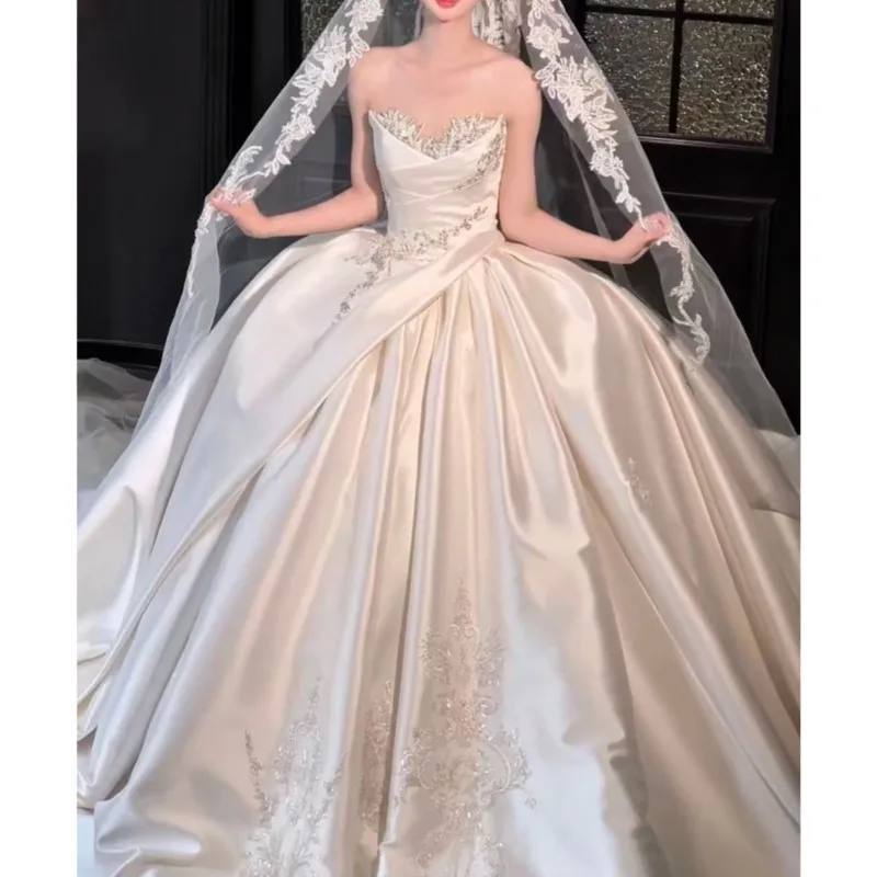 Satin heavy off-the-shoulder, strapless, and textured tulle for a dress
Satin heavy off-the-shoulder, strapless, and textured tulle for a dress