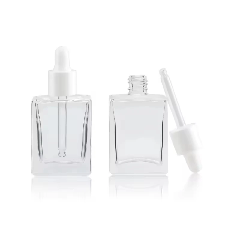 Refillable Clear Rectangular Glass Bottle with Essence Oil Serum Cosmetic Skin Care Packaging Plastic Head Eyedropper Dispenser
Refillable Clear Rectangular Glass Bottle with Essence Oil Serum Cosmetic Skin Care Packaging Plastic Head Eyedropper Dispenser
