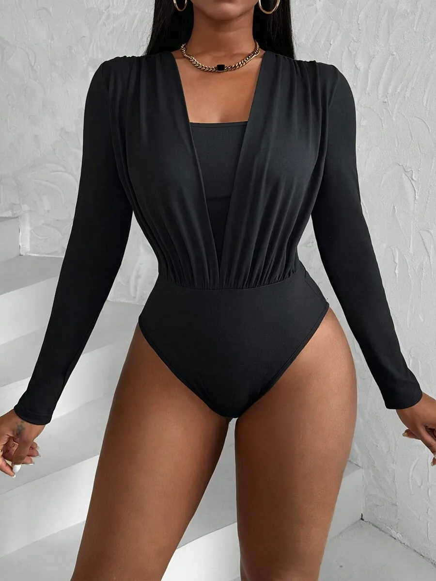 Black Long Sleeve V-Neck Pleated Bodysuit with High Waist Fit
Black Long Sleeve V-Neck Pleated Bodysuit with High Waist Fit