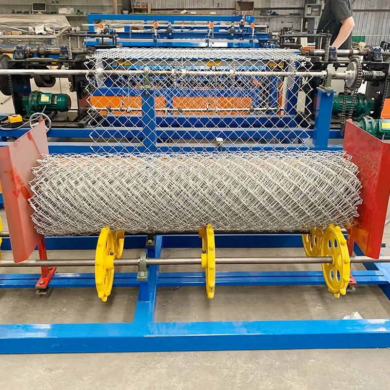 fully automatic Diamond double manual operate wire mesh chain link fence weaving net fencing making machine factory price 
fully automatic Diamond double manual operate wire mesh chain link fence weaving net fencing making machine factory price