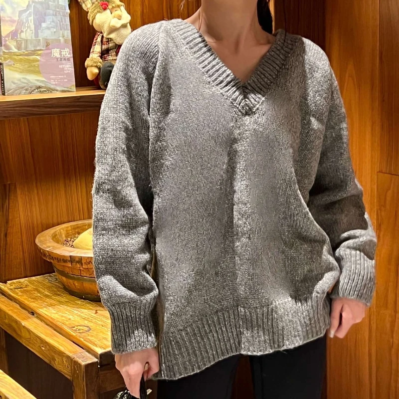 Loose V-neck big sweater women's spring and autumn clothes are thin and versatile medium and long lazy wind knitted sweater
Loose V-neck big sweater women's spring and autumn clothes are thin and versatile medium and long lazy wind knitted sweater
