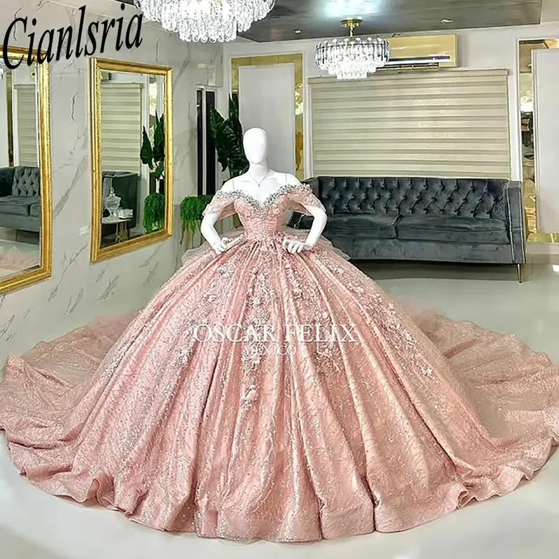 Розовое золото, блестящие кристаллы и бисер, платья Quinceanera, бальное платье с открытыми плечами, сладкий 15, мексиканский индивидуальный заказ
Розовое золото, блестящие кристаллы и бисер, платья Quinceanera, бальное платье с открытыми плечами, сладкий 15, мексиканский индивидуальный заказ