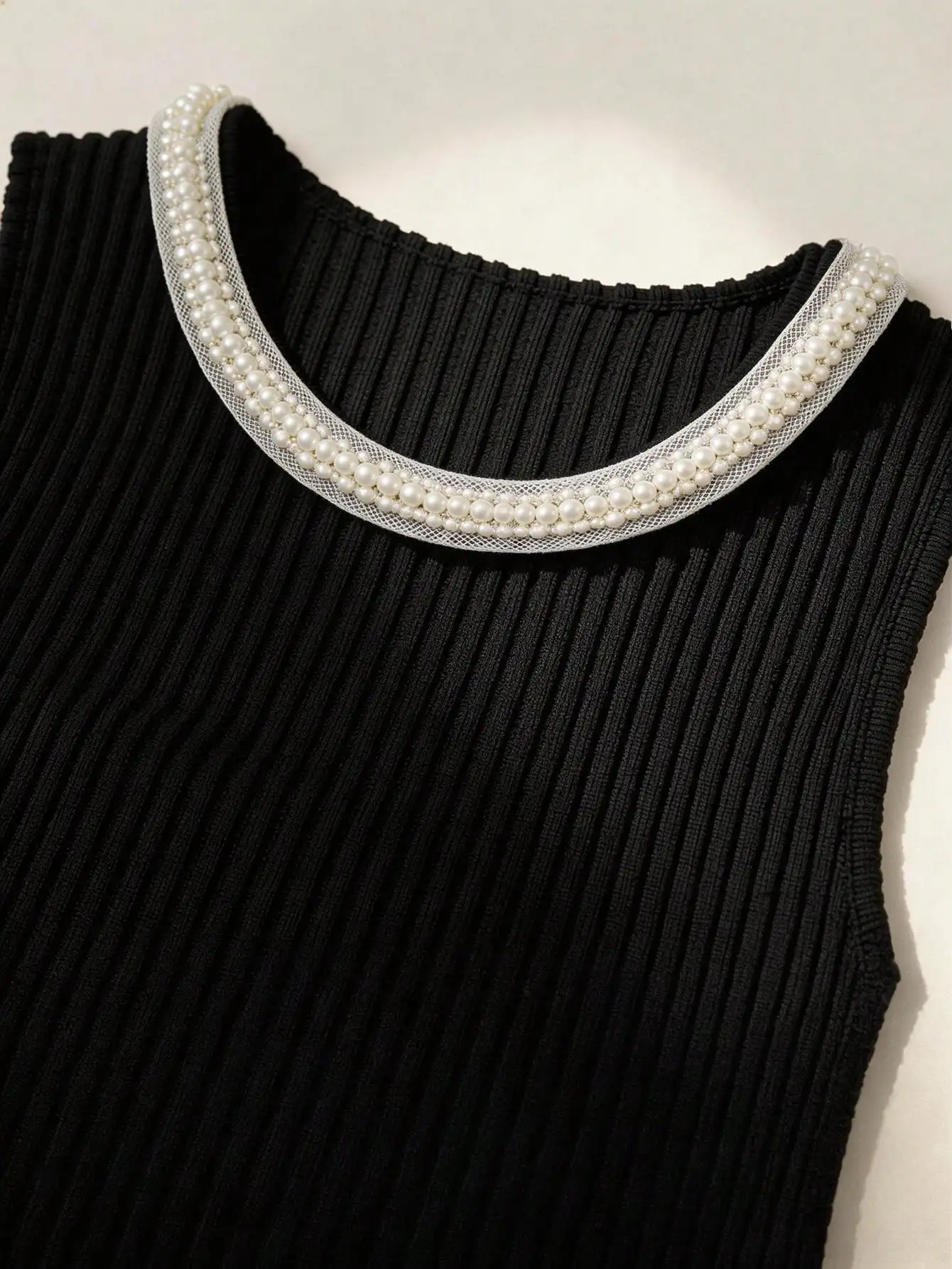 Black Sleeveless Ribbed Midi Dress With Pearl Collar And Front Buttons
Black Sleeveless Ribbed Midi Dress With Pearl Collar And Front Buttons