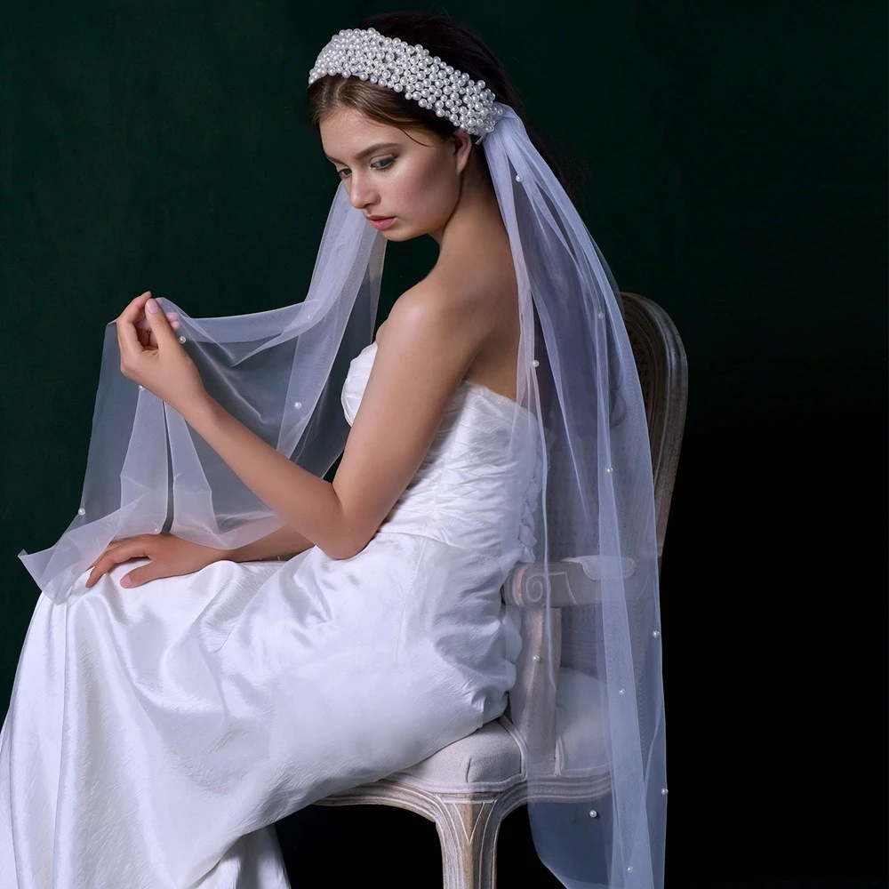Handmade Pearl Beaded Bridal Veil – Wide Edge Wedding Veil with Pearls, Tulle Headpiece for Bride, Cathedral Length
Handmade Pearl Beaded Bridal Veil – Wide Edge Wedding Veil with Pearls, Tulle Headpiece for Bride, Cathedral Length
