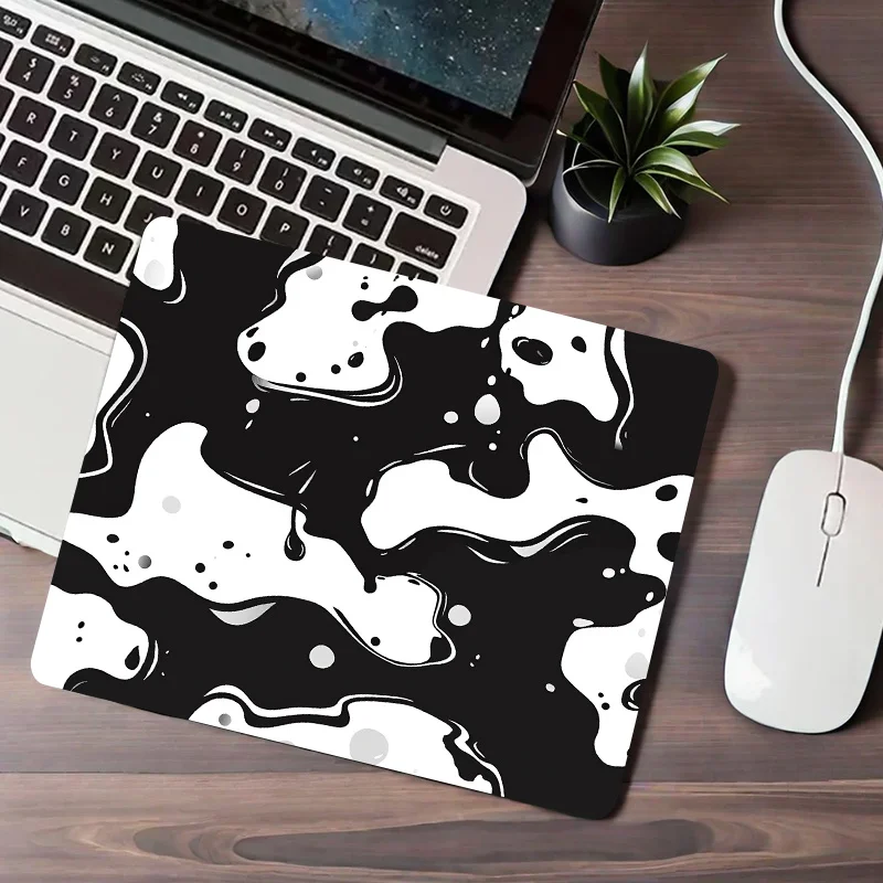 Black and white fluid ink patterned mouse pad, PC office supplies, learning and writing pad, rubber base, anti-slip and washable
Black and white fluid ink patterned mouse pad, PC office supplies, learning and writing pad, rubber base, anti-slip and washable